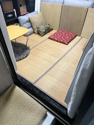 a bed in the back of a car with two pillows at Ayaka's House in Tokyo