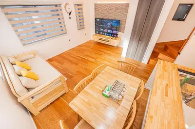 a living room with a table and a couch at Arashi hotel \u5d50\u30db\u30c6\u30eb in Tokyo