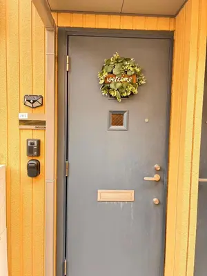 a grey door with a wreath on it at Belle Lead 105 in Tokyo