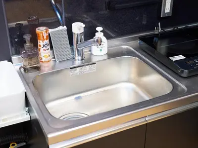 a stainless steel sink in a kitchen at Shinbashi Hotel Sho - Vacation STAY 82917v in Tokyo