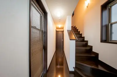 a staircase in a house with wooden floors and a window at Hotel Yuga - Vacation STAY 82984v in Tokyo