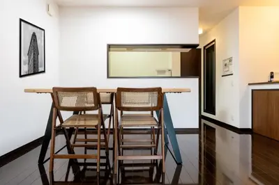 a bar in a kitchen with three stools at Hotel Yuga - Vacation STAY 82984v in Tokyo
