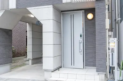 a white door on the side of a building at Hotel Yuga - Vacation STAY 82984v in Tokyo