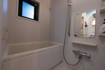 a bathroom with a shower and a bath tub at YIYou Japan\u79cb\u8449\u539f302 in Tokyo