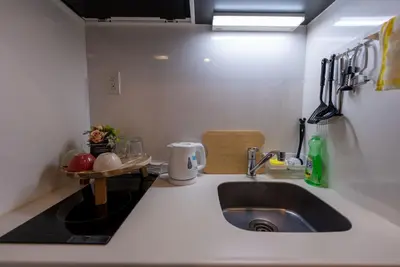 a kitchen with a sink and a counter top at YIYou Japan\u79cb\u8449\u539f302 in Tokyo