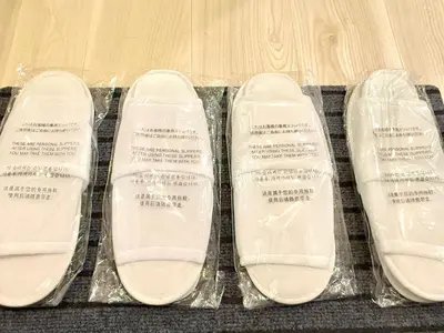 a pair of plastic shoes sitting on a table at Shinjuku city4\u4eba\u53efTV\u4ed8\u304d in Tokyo