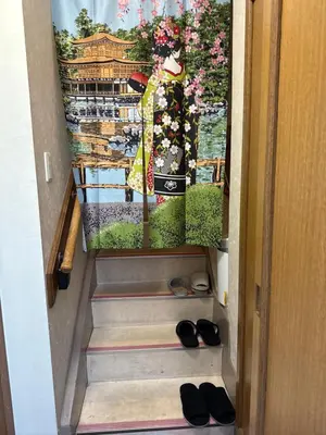 a set of stairs with a pair of shoes at \u7ae5\u7ae5\u6c11\u5bbf in Tokyo