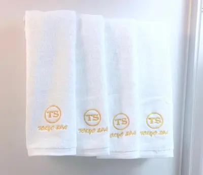 a towel with the words happy anniversary on it at TOKYO SPA Premier UENO in Tokyo
