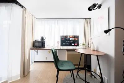 a room with a desk and a chair and a table at SAKURA Residence\u76ee\u9ed2 307 in Tokyo