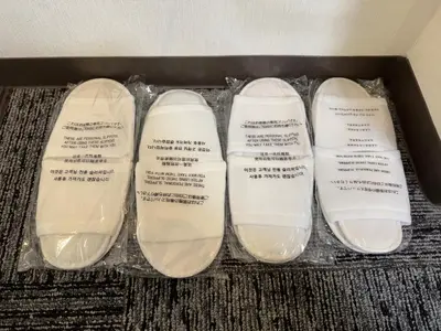 three pairs of white shoes in a box at Shiba inn in Tokyo