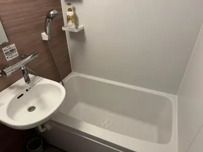 a bathroom with a sink and a bath tub at Shiba inn in Tokyo