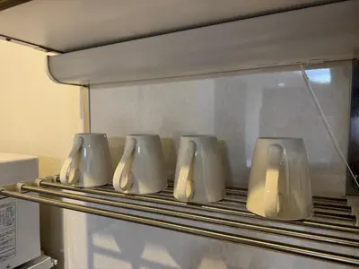 a row of white objects on a rack in a microwave at Shiba inn in Tokyo