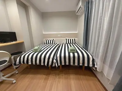 a bedroom with a black and white striped bed at YY-Minamicho 1 room-IT0339 in Tokyo