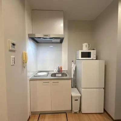 a small kitchen with a sink and a refrigerator at YY-Minamicho 1 room-IT0339 in Tokyo