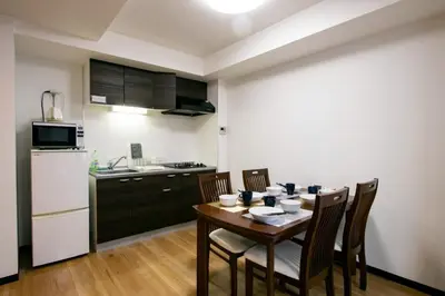 a kitchen and dining room with a table and chairs at Randor Residence Tokyo Annex in Tokyo