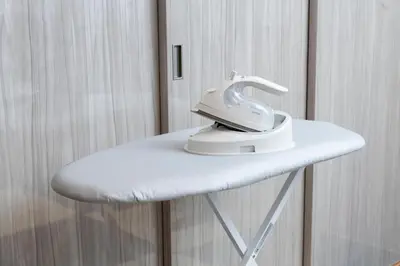 a iron is sitting on top of a white table at ENT TERRACE GINZA Premium in Tokyo