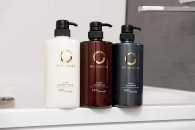 a group of three bottles sitting on a shelf at ENT TERRACE GINZA Premium in Tokyo