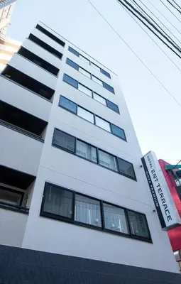 a tall white building with many windows at ENT TERRACE GINZA Premium in Tokyo