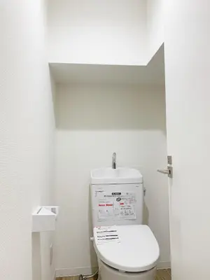 a bathroom with a toilet in a white room at Shinjuku Kabuki Youth Hostel#New Sunshine Room#50 second walk from Higashi Shinjuku subway#Automatic locking door at entrance#\u65b0\u5bbf2 in Tokyo