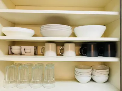 a shelf filled with dishes and other kitchen utensils at PUSU-OKUBO House 3LDK-SJ0079 in Tokyo