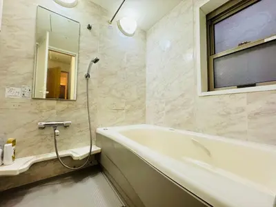 a bathroom with a bath tub and a window at PUSU-OKUBO House 3LDK-SJ0079 in Tokyo