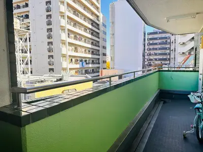 a bike parked on a balcony of a building at Ikebukuro\u4e2d\u5ddd5E -TS0036 in Tokyo