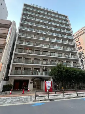 a large tall building with a person standing in front of it at Top Ikebukuro 301 -TS0034 in Tokyo