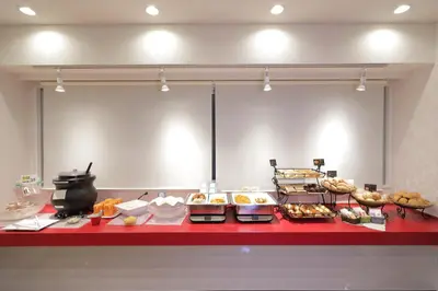 a buffet line with many different types of food at HOTEL Guest1 Ueno Ekimae in Tokyo