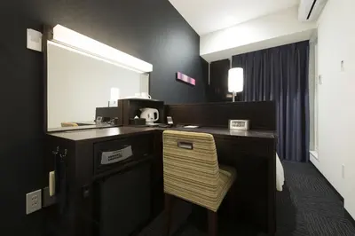 a desk with a chair in a room at HOTEL Guest1 Ueno Ekimae in Tokyo