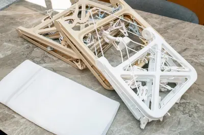a model of a wooden structure on a table at Za086 \u67cf\u539f\u30d3\u30eb101 in Tokyo