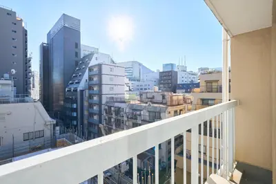 a view of a city from a balcony at B-Shinjuku luxury house with EV Max12P in Tokyo