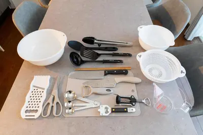 a table with a bunch of kitchen utensils on it at Vivere in Tokyo