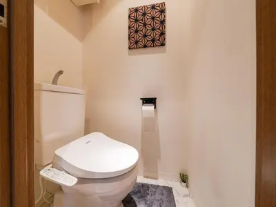 a bathroom with a white toilet in a room at Omotesando Sta 8min walk,Shibuya,Harajuku 3min,10GB net, PocketWiFi, Switch in Tokyo