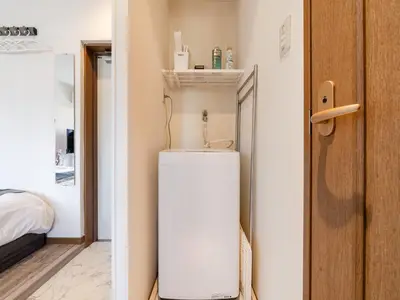a bathroom with a sink in a room at Omotesando Sta 8min walk,Shibuya,Harajuku 3min,10GB net, PocketWiFi, Switch in Tokyo