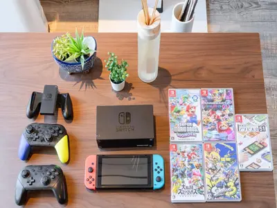 a table with a nintendo wii game system and controllers at Omotesando Sta 8min walk,Shibuya,Harajuku 3min,10GB net, PocketWiFi, Switch in Tokyo