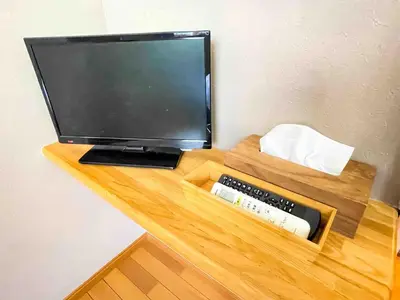 a desk with a computer and a keyboard and a monitor at Vonveil Shibuya in Tokyo