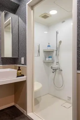 a bathroom with a shower and a sink at NEXUS HOTEL Gotanda WEST in Tokyo