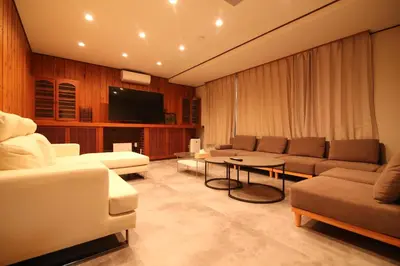 a living room with couches and a tv and a table at Nakai House!! Tokyo Home near Shinjuku - Groups & Families in Tokyo