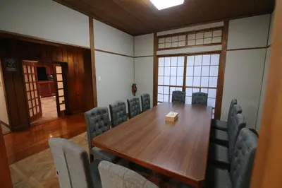 a conference room with a wooden table and chairs at Nakai House!! Tokyo Home near Shinjuku - Groups & Families in Tokyo