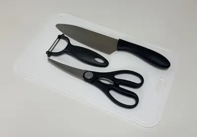 a pair of scissors sitting on a plastic box at \u6771\u771f\u30d3\u30eb3f in Tokyo