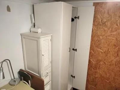 a bedroom with a dresser and a door to a closet at 130Ｍ2 Entire House Max 12 Guests Entire House 5 min to Ikebukuro Perfect for Groups & Families in Tokyo
