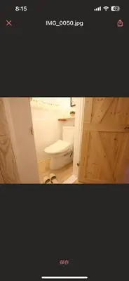 a bathroom with a toilet and a wooden door at 130Ｍ2 Entire House Max 12 Guests Entire House 5 min to Ikebukuro Perfect for Groups & Families in Tokyo