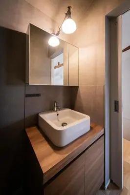 a bathroom with a white sink and a mirror at NOIL 2 \u6c60\u888b Ikebukuro \u6c60\u888b\u99c5\u5f92\u6b6914\u5206 \u690e\u540d\u753a\u99c5\u5f92\u6b695\u5206 in Tokyo