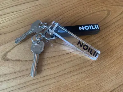 a pair of keys sitting on top of a table at NOIL 2 \u6c60\u888b Ikebukuro \u6c60\u888b\u99c5\u5f92\u6b6914\u5206 \u690e\u540d\u753a\u99c5\u5f92\u6b695\u5206 in Tokyo