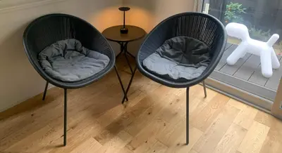 two black chairs sitting in a room with a table at NOIL 2 \u6c60\u888b Ikebukuro \u6c60\u888b\u99c5\u5f92\u6b6914\u5206 \u690e\u540d\u753a\u99c5\u5f92\u6b695\u5206 in Tokyo