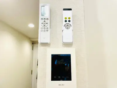 three remote controls are hanging on a wall at Z5-Shinjuku center 4 mins to ST Max 3P-\u65b0\u5bbf\u6700\u4e2d\u5fc3 \u6771\u65b0\u5bbf\u99c54\u5206 \u76f4\u8fbe\u65b0\u5bbf \u6e0b\u8c37 \u8868\u53c2\u9053 \u6c60\u888b \u4e0a\u91ce \u4ee3\u4ee3\u6728 \u9280\u5ea7 \u539f\u5bbf in Tokyo