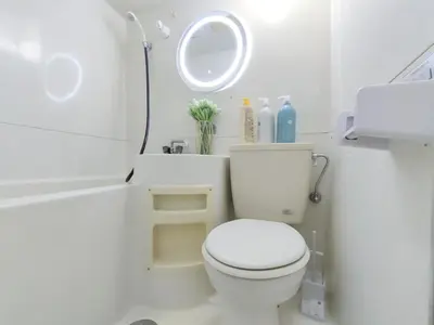 a white bathroom with a toilet and a sink at G35\u65b0\u5bbf\u6700\u4e2d\u5fc3 \u6771\u65b0\u5bbf\u7ad95\u5206-Shinjuku center 5 mins to st, Max 4P \u65b0\u5bbf \u6d89\u8c37 \u8868\u53c2\u9053 \u6c60\u888b \u4e0a\u91ce \u4ee3\u4ee3\u6728 \u94f6\u5ea7 \u539f\u5bbf in Tokyo