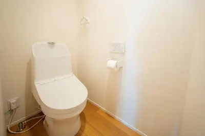 a bathroom with a white toilet in a room at \u745e\u306e\u5bbf\u6d45\u8349 in Tokyo