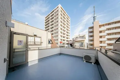 a balcony with a view of a building at \u745e\u306e\u5bbf\u6d45\u8349 in Tokyo