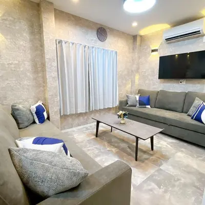 a living room with a couch and a table at 103, Higashi-Yotsugi 3A, Entire house for rent, \u6771\u56db\u3064\u67283A in Tokyo